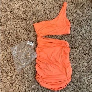 Bright orange club dress.